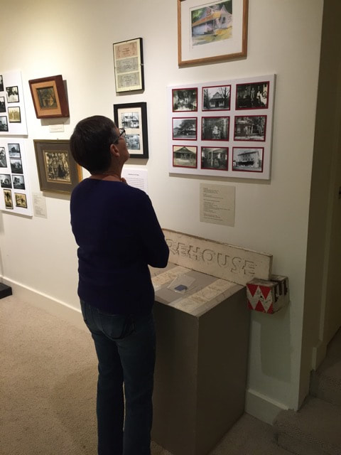 Museum and Archives Committee member Pat Morrison learns about early businesses in the Ardens.