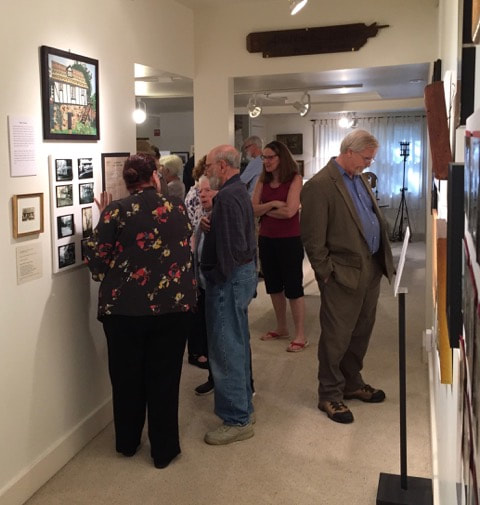 Museum and Archives committee member Barbara Macklem shows Harry and Betty Ann Themal a display on Ardentown.